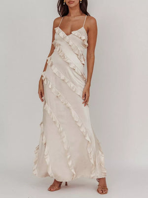 Beige ruffled spaghetti strap maxi dress with diagonal ruffle details.