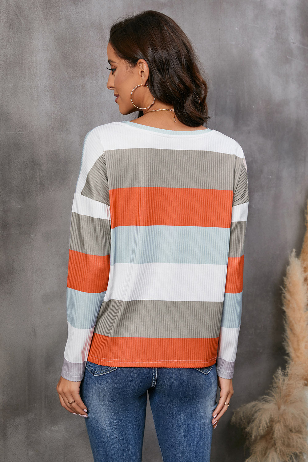 Ribbed stripe long sleeve top in orange, grey, and light blue.