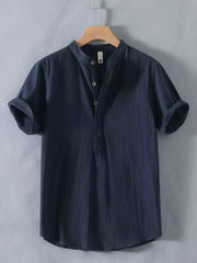 Dark blue cotton short sleeve shirt with band collar and button detail