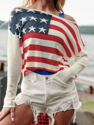 American flag off-shoulder knit sweater in ivory with red and white stripes and blue star detail.