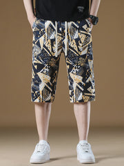 Men's geometric print drawstring chino shorts in navy, yellow, and white abstract pattern.