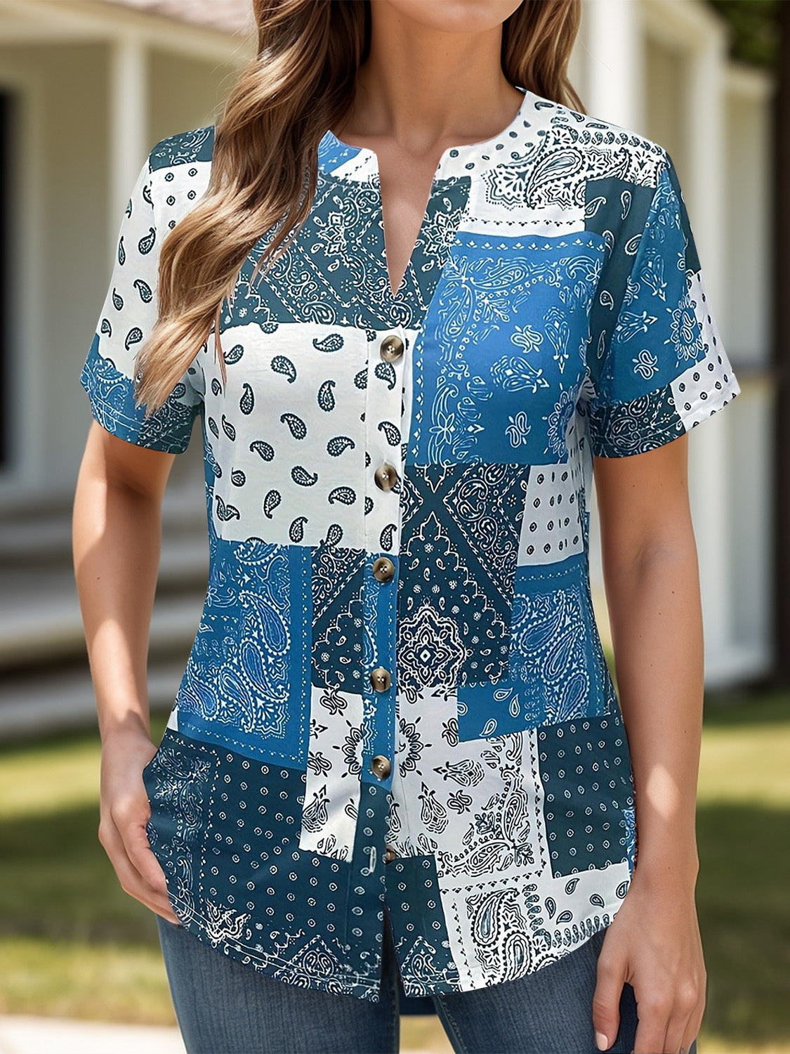 Blue bandana patchwork henley blouse with button front and short sleeves.