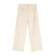 Cream wide-leg denim jeans with angular seams and a casual fit.
