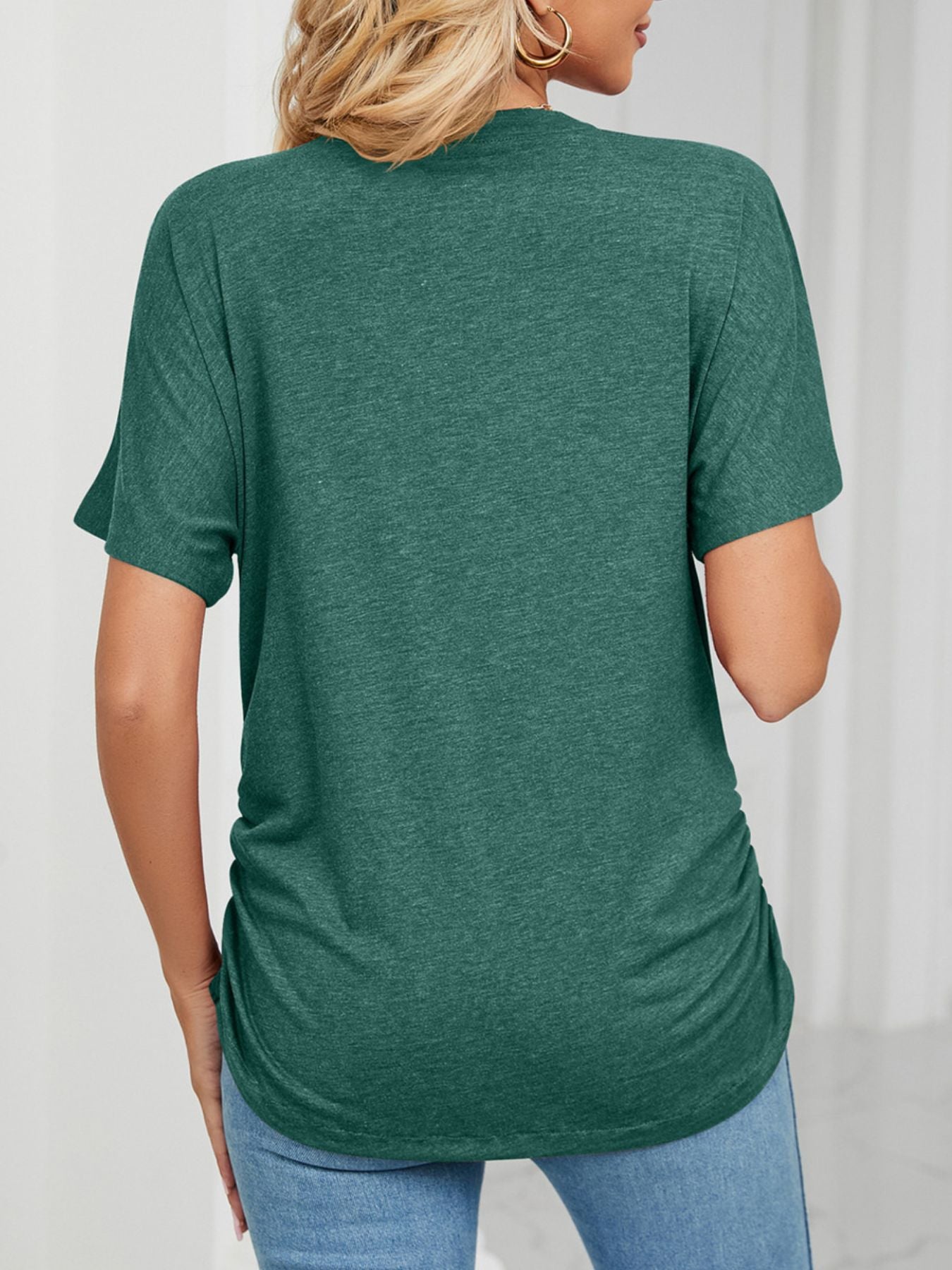 Dark green V-neck t-shirt with short sleeves and ruched side detail.