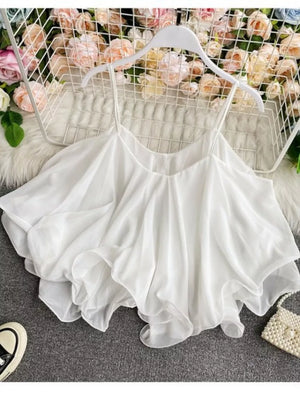 White ruffled camisole with spaghetti straps and a flowy hem.