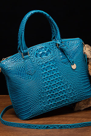 Sky blue crocodile embossed satchel with top handle and crossbody strap.
