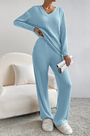Light blue ribbed knit lounge set with V-neck sweater and wide-leg pants.