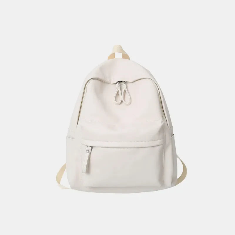 Minimalist ivory leather backpack with front zip pocket and double top zippers.