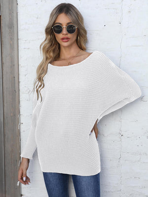 White ribbed dolman knit sweater with off-the-shoulder neckline and long sleeves.