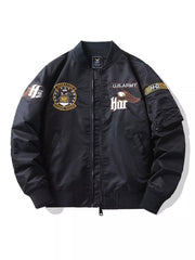 Black embroidered bomber jacket with U.S. Army and eagle patches, zip front, and ribbed cuffs.