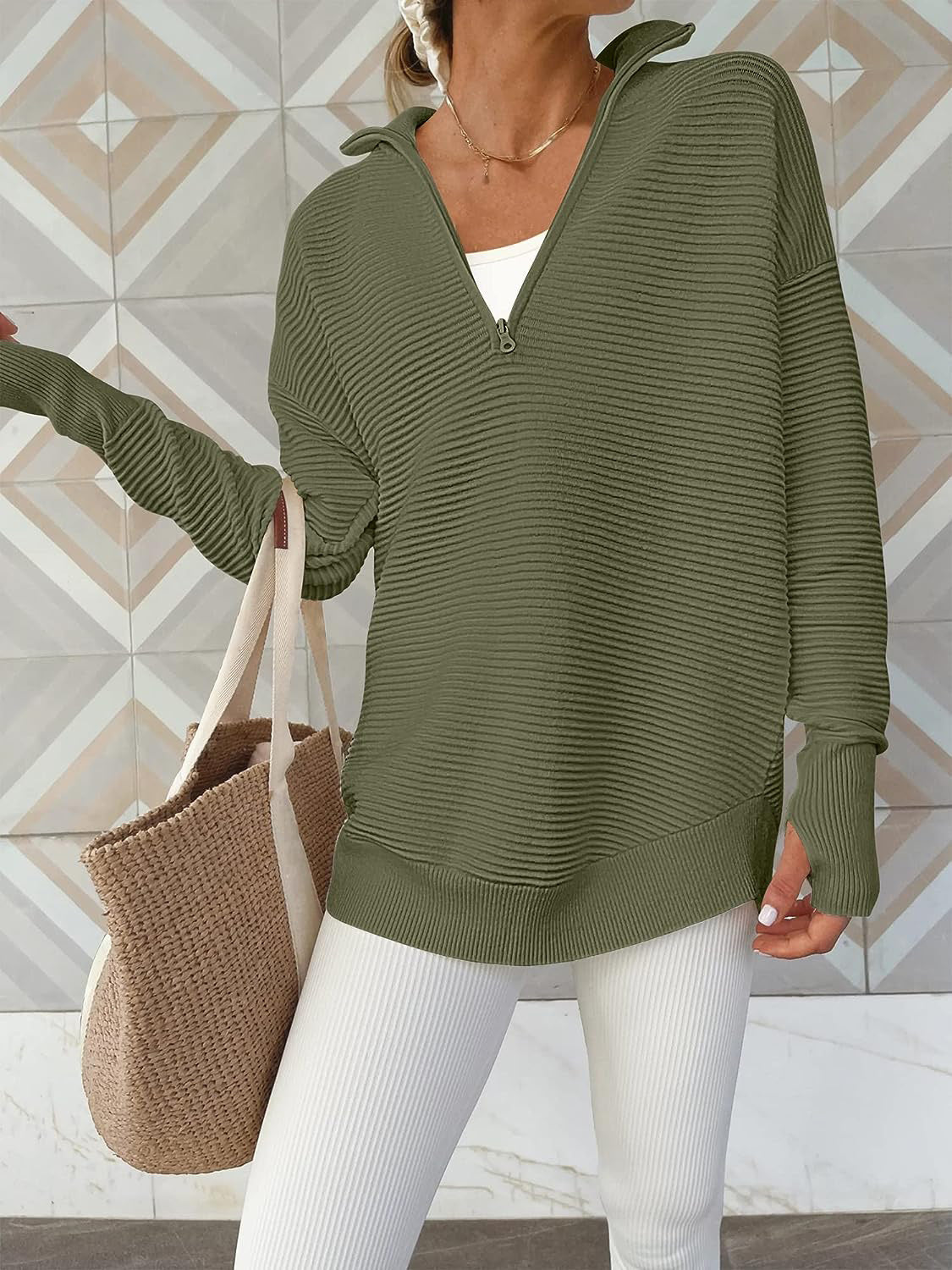 Moss ribbed knit pullover with funnel neck and quarter zip, long sleeves with thumbholes.