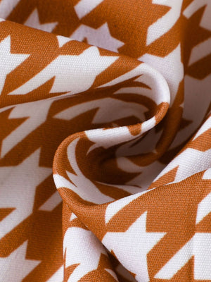 Toddler three-piece vest and skirt set fabric detail with brown and white houndstooth pattern.