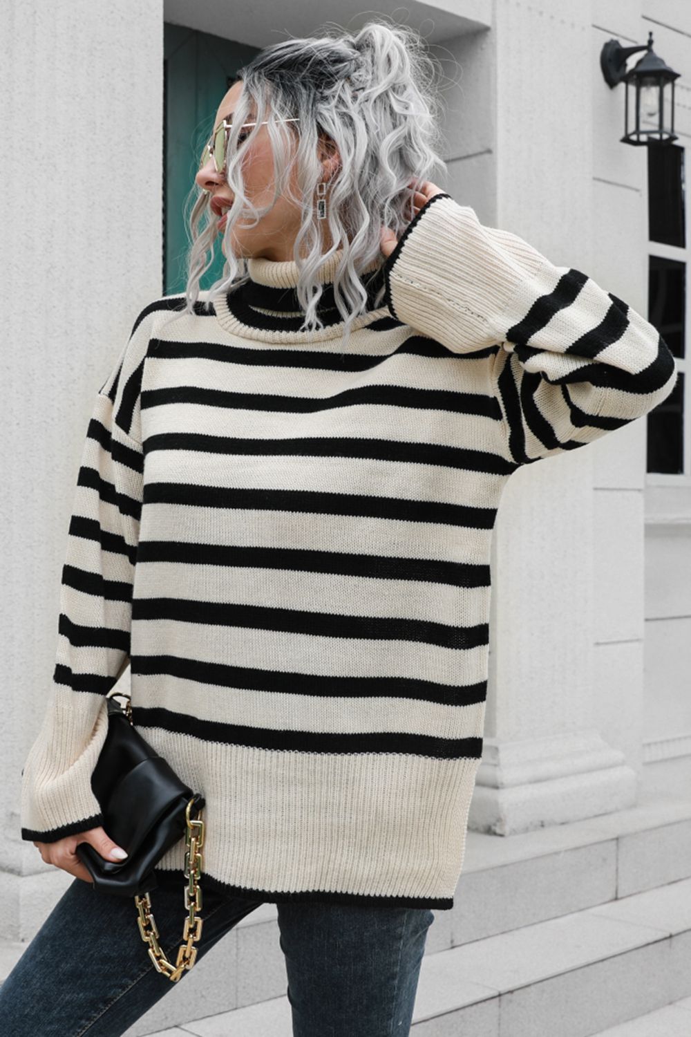 Beige and black striped acrylic turtleneck sweater with wide bell sleeves.