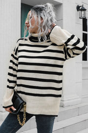 Beige and black striped acrylic turtleneck sweater with wide bell sleeves.