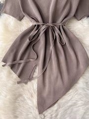 Tied waist two-piece set in khaki with wide legs and asymmetric hem detail.