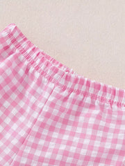 Pink gingham cotton baby shorts with elastic waistband and ruffled detail.