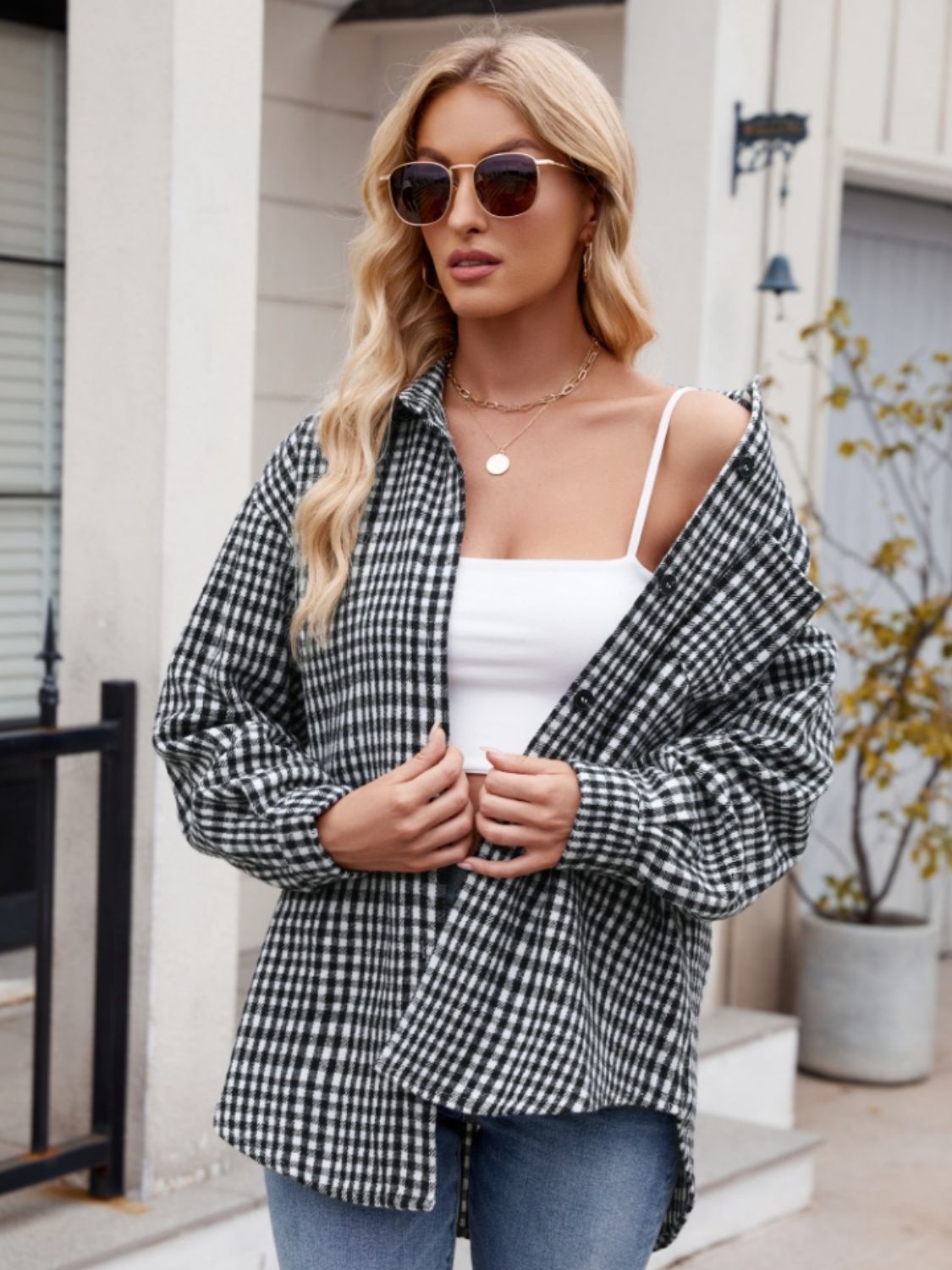 Oversized black gingham shirt jacket with button front and chest pocket, worn open over a white cami.