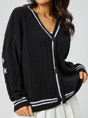 Black cable knit cardigan with white stripe trim and embroidered stars on sleeve.