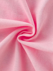 Pink cotton t-shirt fabric detail with soft texture.