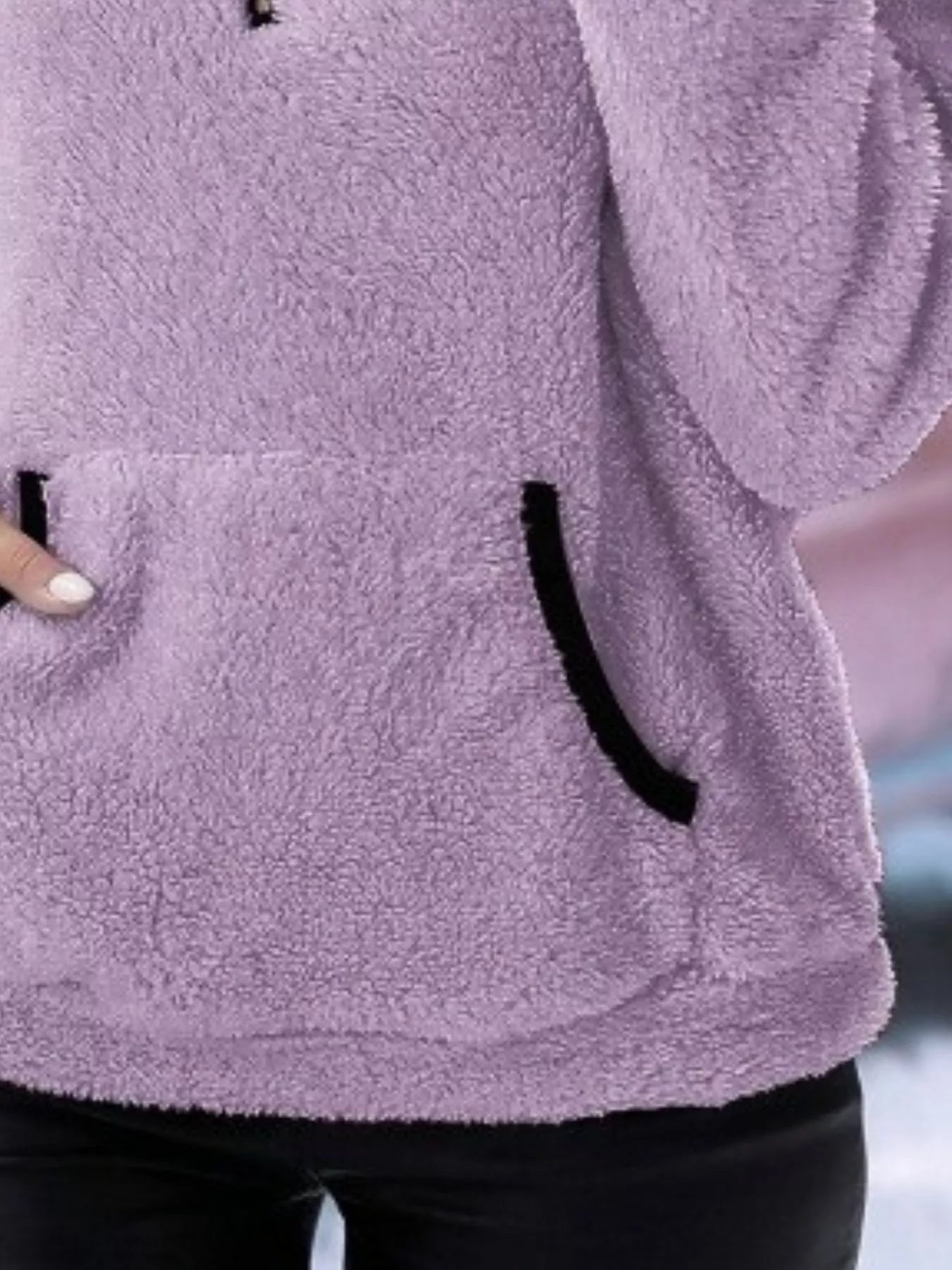 Purple fleece quarter zip pullover with black trim on pocket.