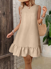 Beige linen blend sleeveless mini dress with ruffled hem and round neckline.