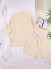 Gauze cotton resort shirt and shorts set in Tan, with buttoned shirt and elastic waist shorts.