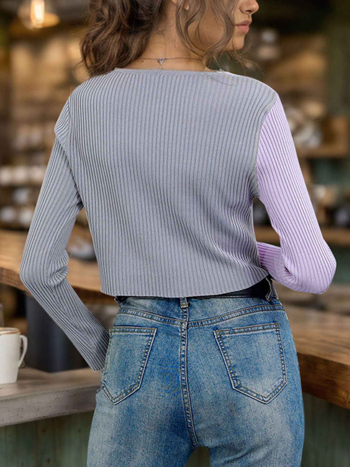 Colorblock ribbed cropped cardigan in lavender and grey, with long sleeves and a crew neck.