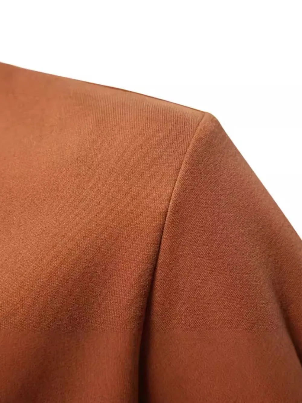 Colorblock zip-neck sweatshirt in caramel with textured fabric detail.