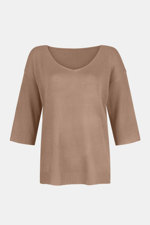 Tan knit sweater with V-neck and flared 3/4 sleeves.