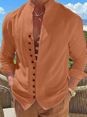 Tangerine linen shirt with mandarin collar and button placket, long sleeves.
