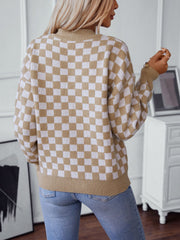 Checkerboard knit pullover sweater in camel and white with a mock neck.