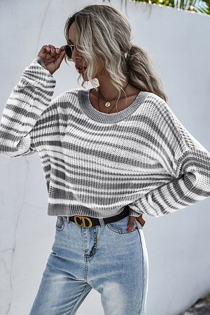 Cropped knit crew neck sweater with horizontal black and white stripes.