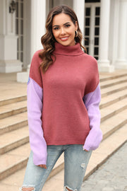 Colorblock turtleneck sweater with asymmetric hem in rust and lavender, featuring a relaxed fit.