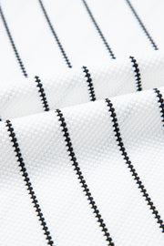 White blouse with black chevron stripes and textured fabric detail