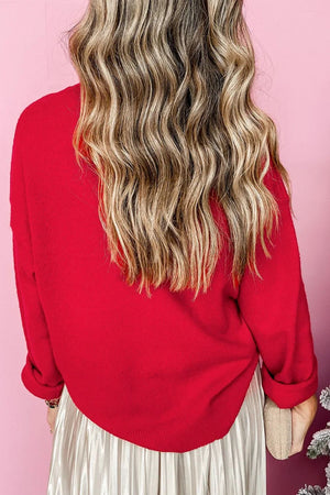 Embellished red knit crewneck sweater with cuffed sleeves.