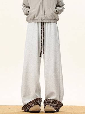 Gray sweatpants with leopard print trim on drawstring and cuffs.