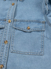 Light wash denim button-down shirt with two chest pockets and ruffled details.