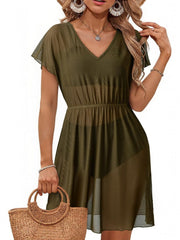 Green sheer mini dress with V-neck, short sleeves, and elastic waist.