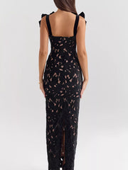 Black floral lace maxi dress with tie shoulder straps and a thigh-high slit.