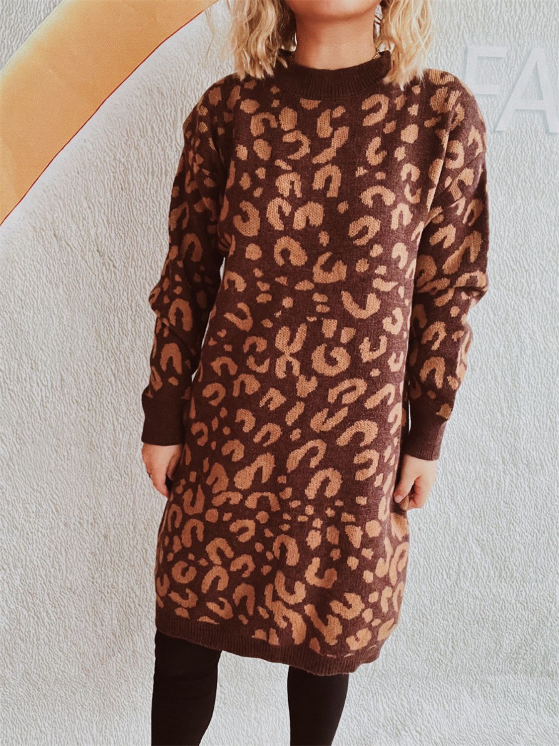 Leopard knit mini dress in caramel with long sleeves and a crew neck.
