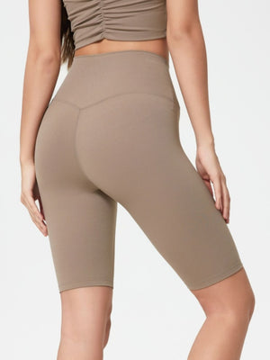 Sculpted Contour Active Cycling Shorts in Mocha. High-waisted, seamless activewear shorts with a v-seam detail.