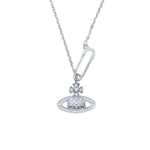 Silver pendant necklace with orb and safety pin charms, encrusted with crystals.