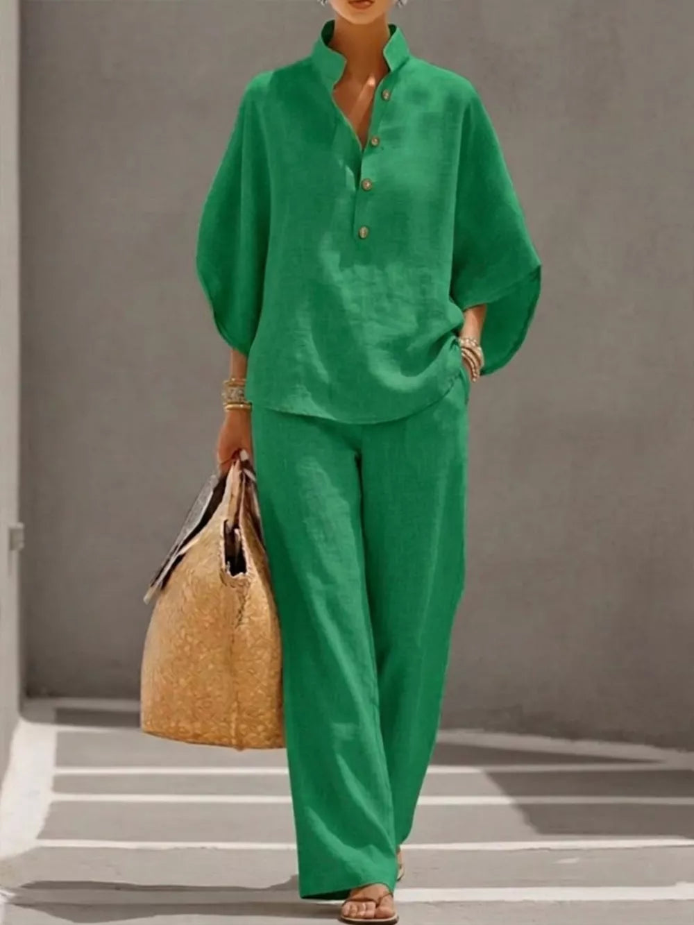 Green button-down loungewear set with wide-leg pants and a relaxed-fit top.