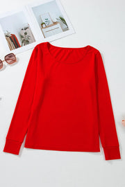 Red long sleeve lounge top with crew neck and cuffed sleeves.