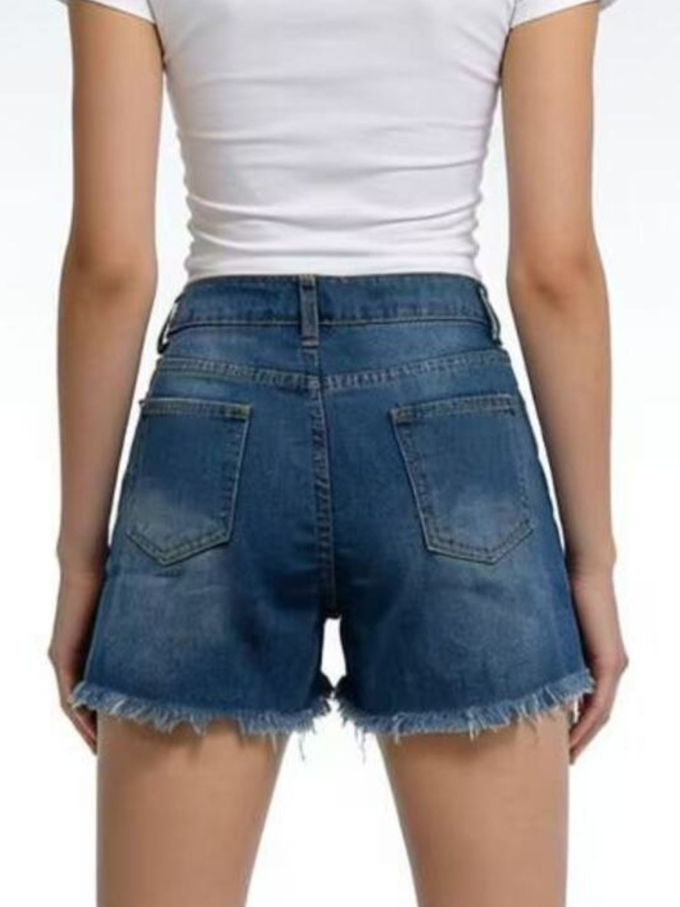 Dark blue denim shorts with distressed details and frayed hem