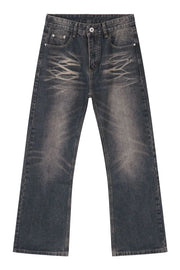 Faded wash wide-leg jeans in medium blue denim with a distressed pattern.