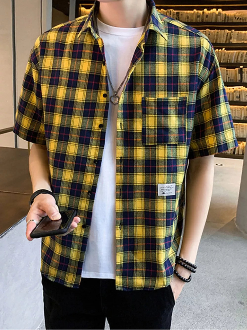 Yellow plaid short sleeve button-down shirt with chest pocket over white tee