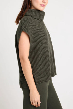 Sleeveless ribbed turtleneck sweater in army green acrylic with wide armholes.
