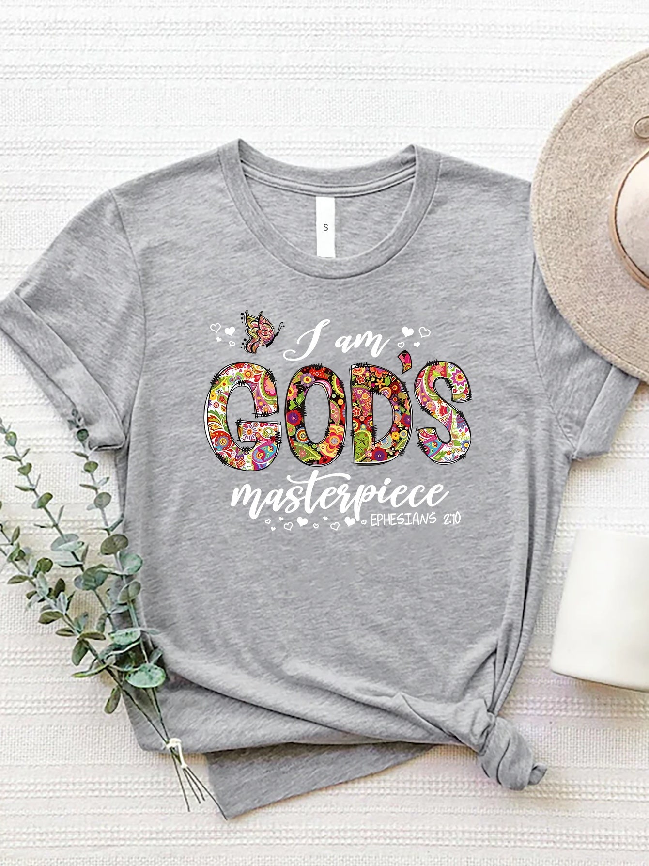 Light Gray t-shirt with floral typography graphic that reads "I am GOD's masterpiece".