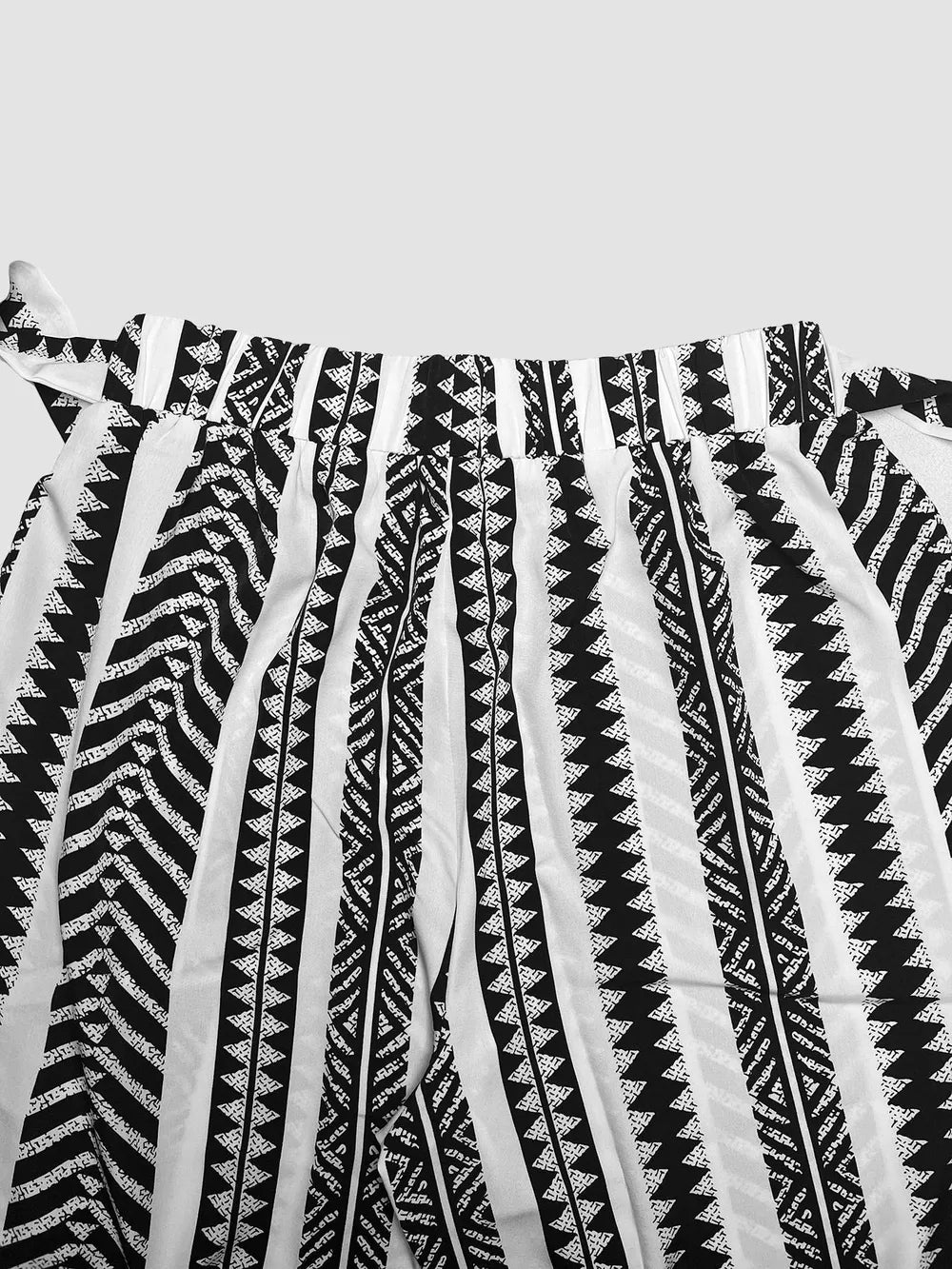 Black and white geometric print maternity pants with adjustable bow detail